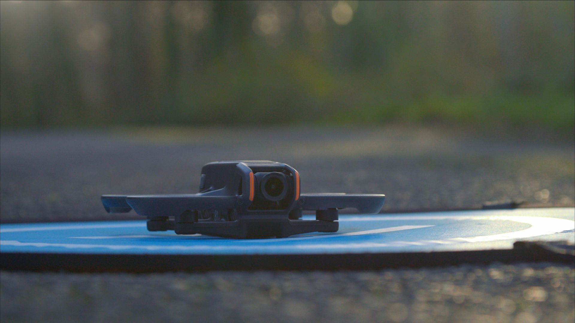 fpv drone on landing pad sitting on a road
