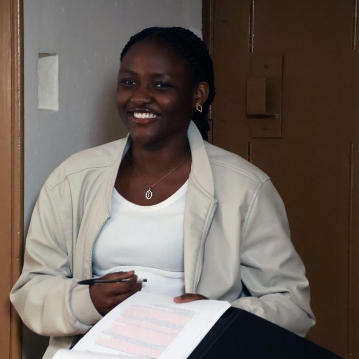 Young female filmmaker with notes