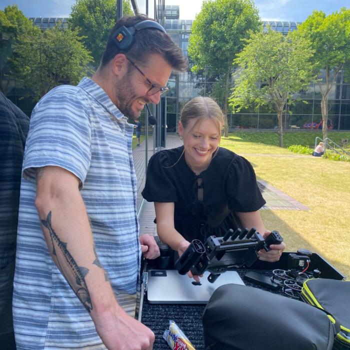 lauren and darren looking at a drone screen