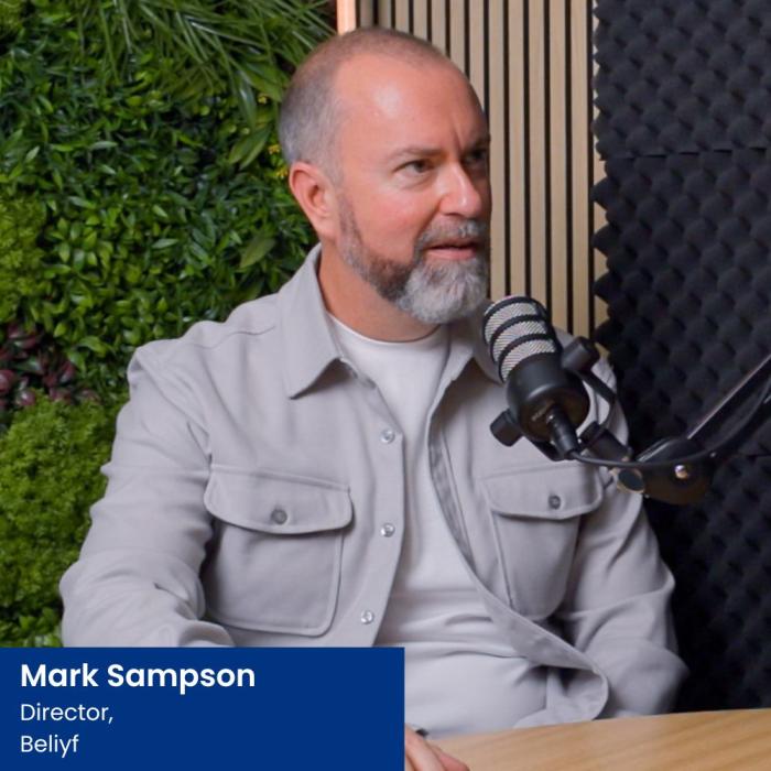 mark sampson from Beliyf sat in a podcast studio
