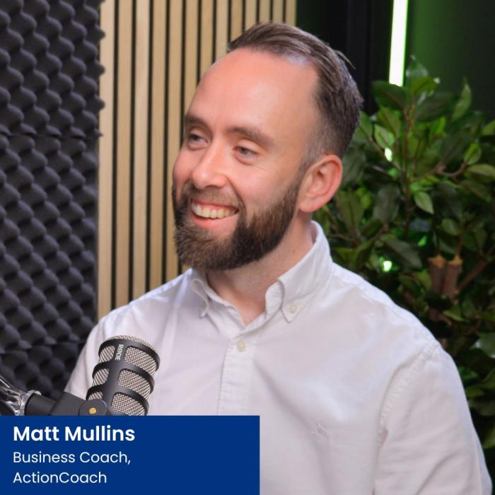matt mullins from ActionCoach sat in a podcast studio