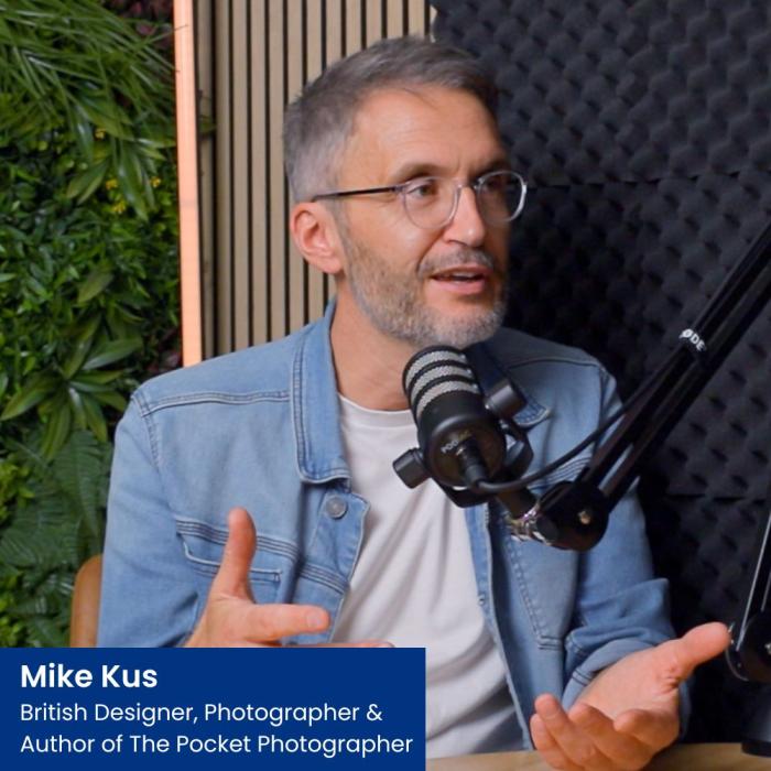 mike kus sat in a podcast studio