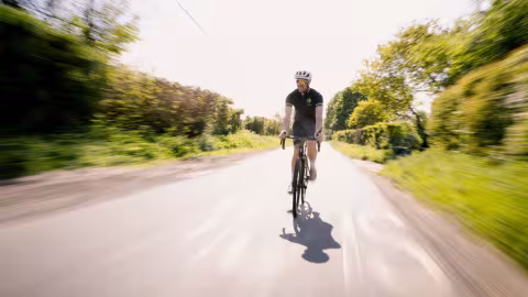 bens cycling along a country lane