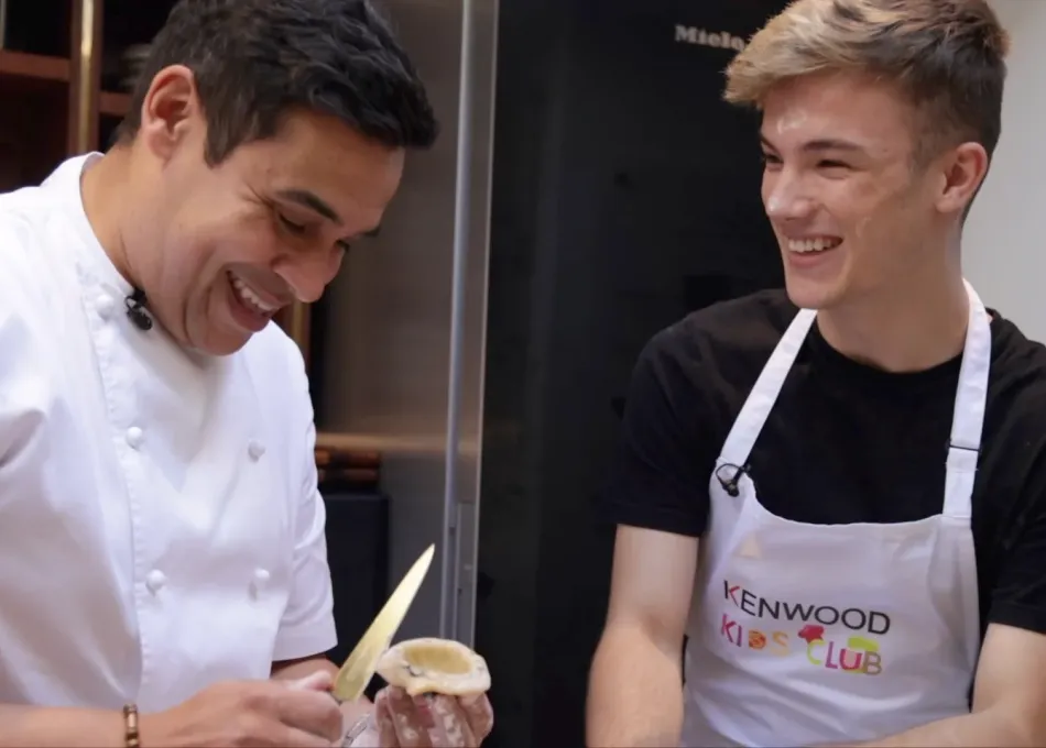 Professional chef with young adult peeling food