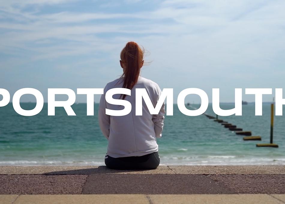 Female student sitting on Portsmouth Sea Front