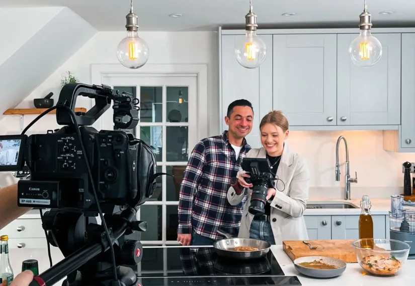 theo michaels and lauren in kitchenn behind the scenes