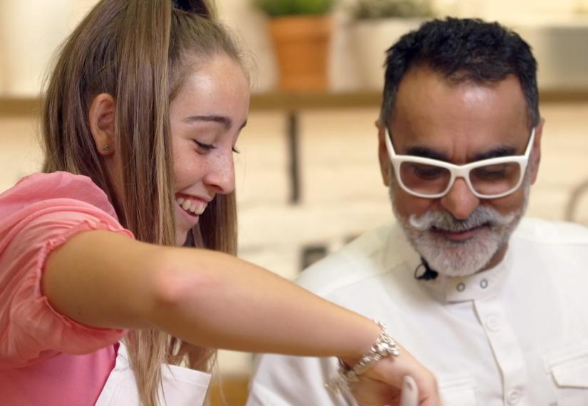 Young person and chef preparing food