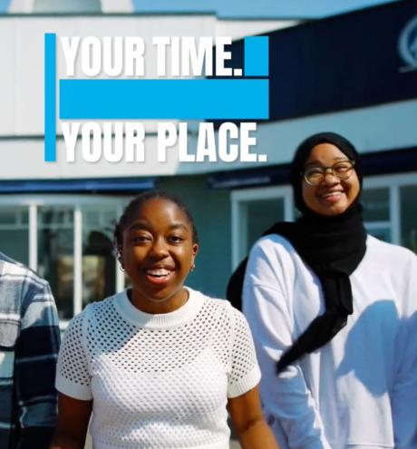 University of Portsmouth students walking toward camera
