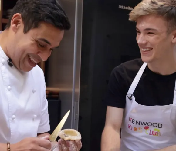 Professional chef with young adult peeling food