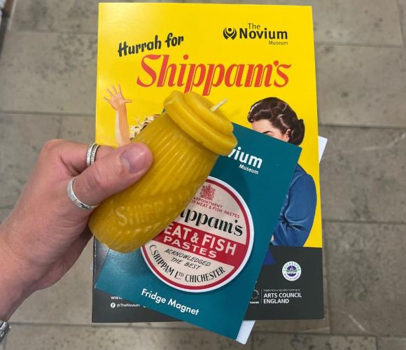 a hand holding shippams exhibition merchandise