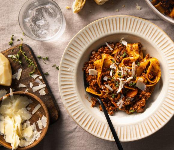 Pasta in a bowl on a clothed table top