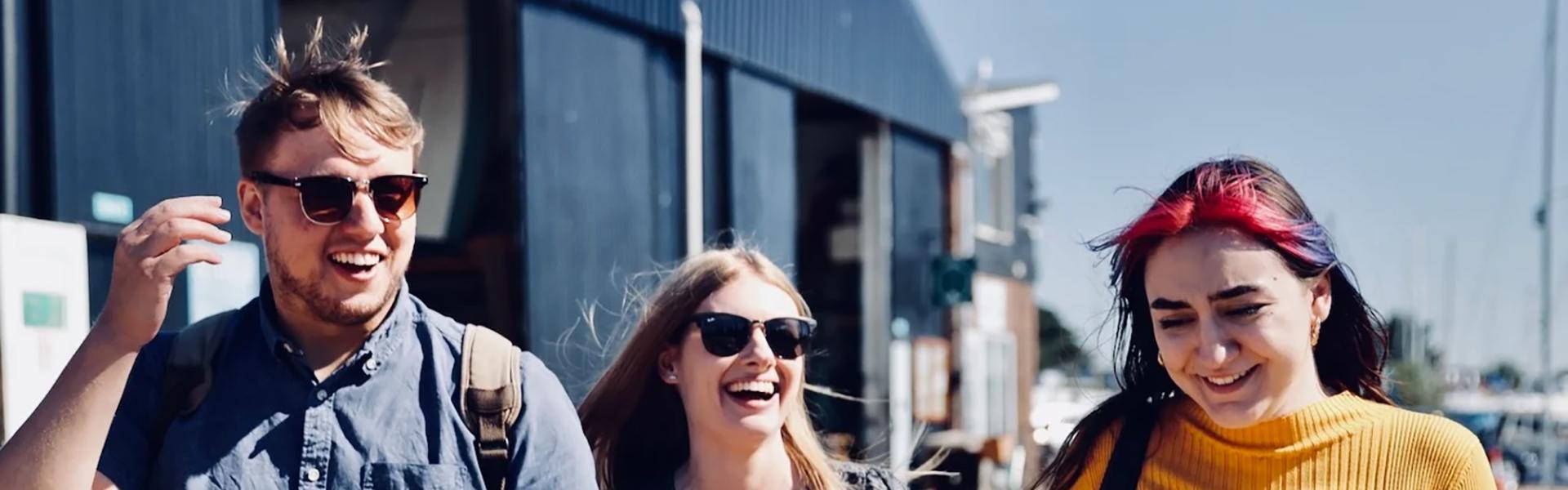 Millstream Production Team walking in boat yard