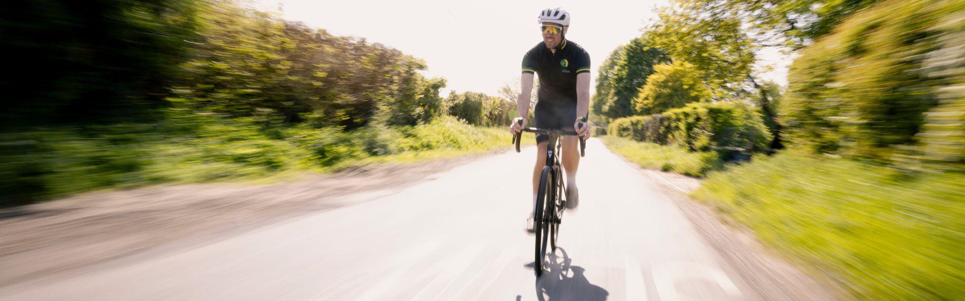 bens cycling along a country lane