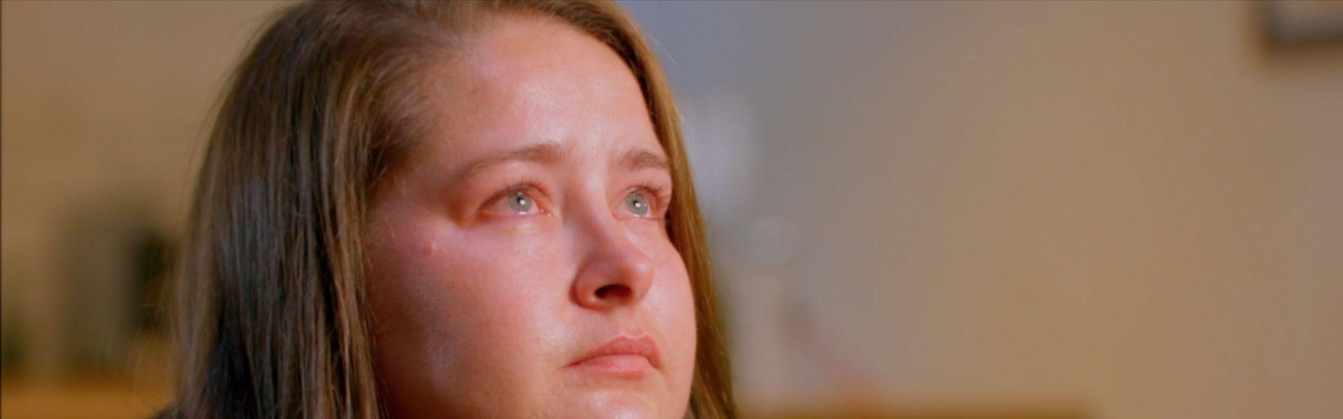 Someone looking up with tears in their eyes
